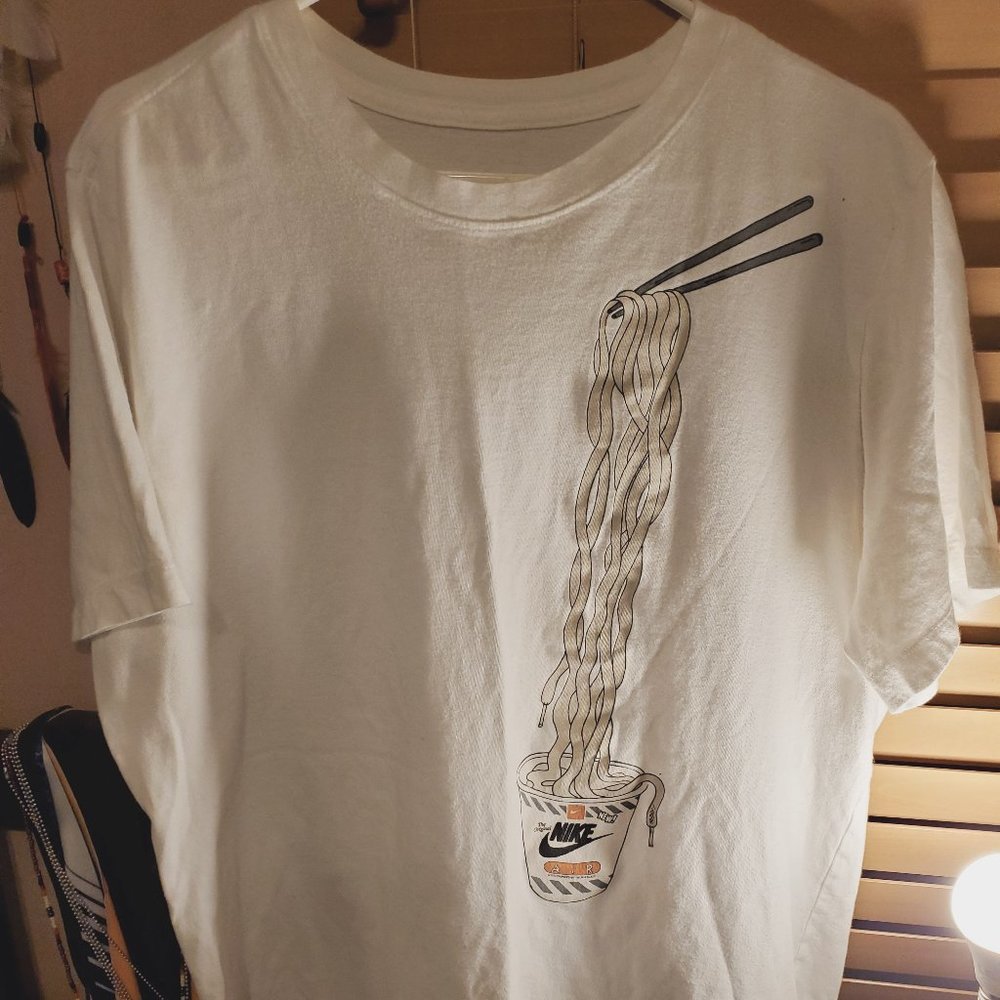 White noodle Nike shirt